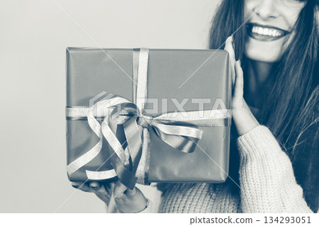 Person holding gift box. Person holding gift box. 134293051