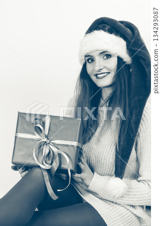 Woman holding gift box. Christmas time 134293087