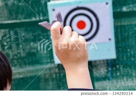 Child throwing shuriken (8-year-old boy) Child throwing shuriken (8-year-old boy) 134293214
