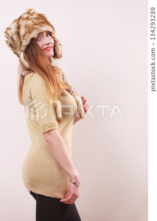 Winter woman in warm clothing fur cap 134293289