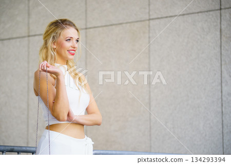 Woman wearing crop top and culottes Woman wearing crop top and culottes 134293394