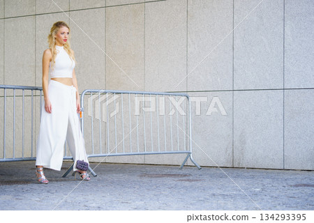 Woman wearing crop top and culottes Woman wearing crop top and culottes 134293395