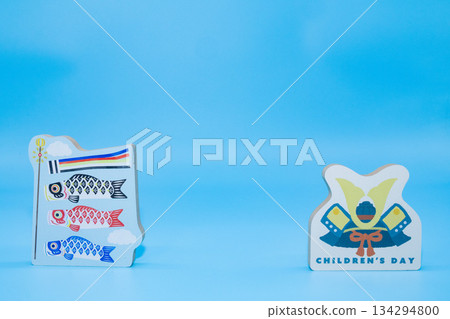 Carp streamers and helmet decorations placed on a light blue background. Image of Children's Day or Boy's Day. 134294800