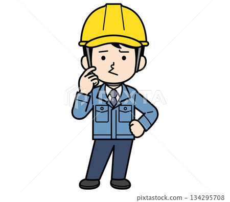 A male site supervisor wearing a helmet with a dissatisfied look on his face 134295708