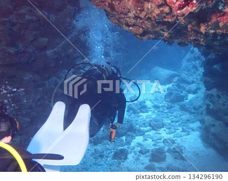Diver swimming in a bright cave Diver swimming in a bright cave 134296190