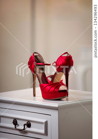 Elegant high heels woman shoes rest on an aesthetic background, good for creating a striking fashion still life perfect for beauty, footwear, or fashion retail campaigns 134296493
