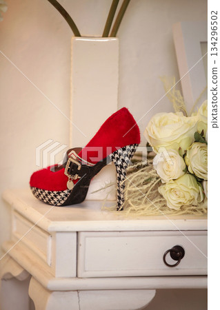 Elegant high heels woman shoes rest on an aesthetic background, good for creating a striking fashion still life perfect for beauty, footwear, or fashion retail campaigns 134296502