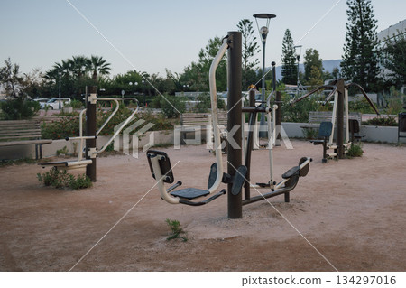 Public fitness space: outdoor gym equipment freely available for community exercise 134297016