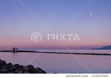 Romantic twilight sky over Agios Nikolaos chapel in Georgioupolis Crete Romantic twilight sky over Agios Nikolaos chapel in Georgioupolis Crete 134297064