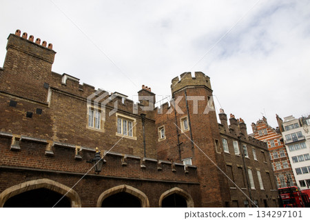 Historic Brick Building With Towers in Urban Setting on a Cloudy Day in London Historic Brick Building With Towers in Urban Setting on a Cloudy Day in London 134297101