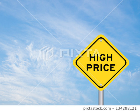 Yellow transportation sign with word high price on blue color sky background Yellow transportation sign with word high price on blue color sky background 134298121