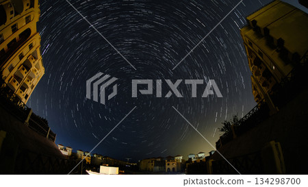 Star Trails Over Night Cityscape 134298700