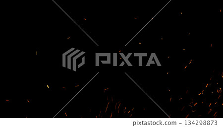 Realistic fire sparks flying through the air, isolated on a black background. Perfect as a cinematic VFX overlay, fire particles effect or visual element. Realistic fire sparks flying through the air, isolated on a black background. Perfect as a cinematic VFX overlay, fire particles effect or visual element. 134298873