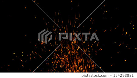 Realistic fire sparks flying through the air, isolated on a black background. Perfect as a cinematic VFX overlay, fire particles effect or visual element. 134298881