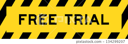 Yellow and black color with line striped label banner with word free trial 134299207