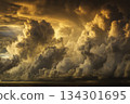 Clouds build up over the ocean at sunset, creating a striking view of nature's colors and formations 134301695