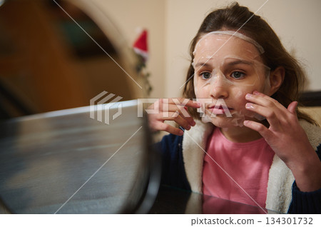 Young Girl Applying Facial Sheet Mask At Home, Preparing For Skincare Routine 134301732