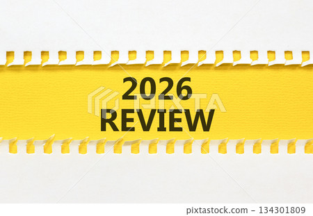 2026 Review symbol. Concept words 2026 Review on beautiful yellow paper. Beautiful white paper background. Business and 2026 review concept. Copy space. 2026 Review symbol. Concept words 2026 Review on beautiful yellow paper. Beautiful white paper background. Business and 2026 review concept. Copy space. 134301809