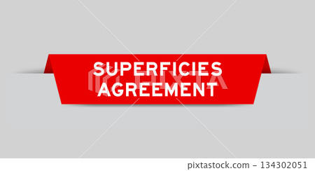 Red color inserted label with word superficies agreement on gray background 134302051
