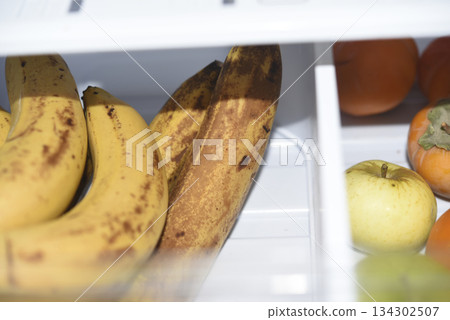 Ripe fruits in the refrigerator compartment. Fruits are in the fridge. 134302507