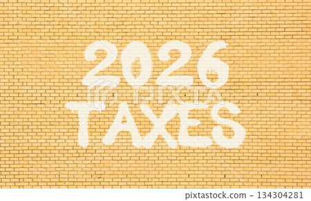 2026 taxes new year symbol. Concept words 2026 taxes on beautiful old brown brick wall. Beautiful old brown brick wall background. Business and 2026 taxes new year concept. Copy space. 2026 taxes new year symbol. Concept words 2026 taxes on beautiful old brown brick wall. Beautiful old brown brick wall background. Business and 2026 taxes new year concept. Copy space. 134304281