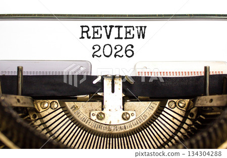 Review 2026 symbol. Concept words Review 2026 typed on beautiful old retro typewriter. Beautiful white paper background. Beautiful old typewriter. Business and review 2026 concept. Copy space. 134304288