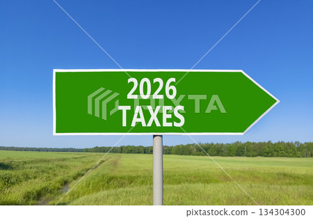 2026 taxes new year symbol. Concept words 2026 taxes on beautiful green road sign. Beautiful green grass field forest and blue sky background. Business and 2026 taxes new year concept. Copy space. 2026 taxes new year symbol. Concept words 2026 taxes on beautiful green road sign. Beautiful green grass field forest and blue sky background. Business and 2026 taxes new year concept. Copy space. 134304300