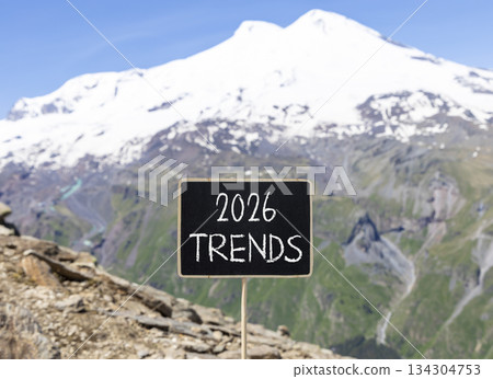 2026 Trends new year symbol. Concept words 2026 Trends on beautiful black blackboard. Beautiful mountain Elbrus and blue sky background. Business and 2026 Trends new year concept. Copy space. 134304753