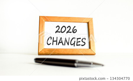 2026 Changes symbol. Concept words 2026 Changes on beautiful wooden picture frame. Beautiful white paper background. Beautiful black pen. Business and 2026 changes concept. Copy space. 2026 Changes symbol. Concept words 2026 Changes on beautiful wooden picture frame. Beautiful white paper background. Beautiful black pen. Business and 2026 changes concept. Copy space. 134304770