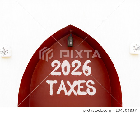 2026 taxes new year symbol. Concept words 2026 taxes on beautiful white and red wall. Beautiful white and red wall background. Business and 2026 taxes new year concept. Copy space. 134304837