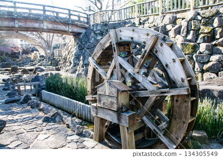 A narrow stone-paved waterway under bright sunlight at Otonashi Water Park in Oji, Tokyo 134305549