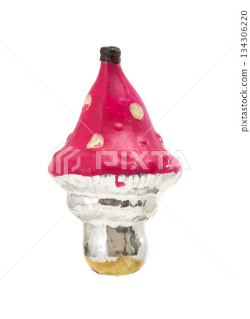 Vintage glass Christmas ornament: red mushroom with white spots, reflective silver gold stem, isolated on white. Vintage glass Christmas ornament: red mushroom with white spots, reflective silver gold stem, isolated on white. 134306220