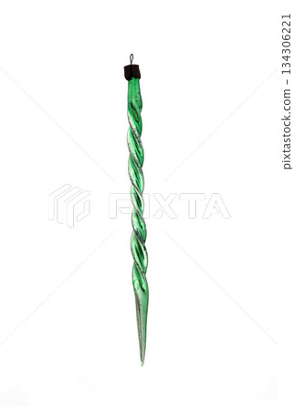 Vintage glass Christmas ornament, bright green icicle with an intricate spiral, twisted, isolated on white backdrop. 134306221