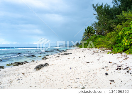 Tropical beach with white sand and turquoise waters on Huahine island, French Polynesia 134306263