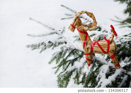 Julbock Christmas goat. Straw Goat in Snowy Pines 134306517
