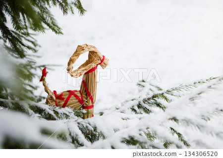 Julbock Christmas goat. Straw Goat in Snowy Pines 134306520