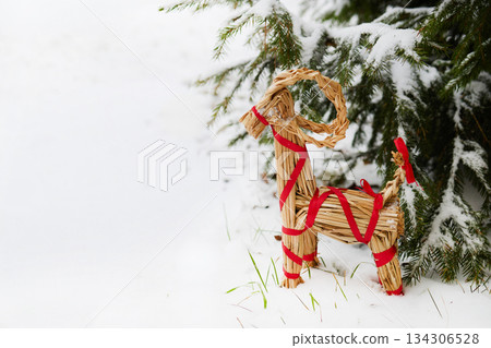 Julbock Christmas goat. Straw Goat in Snowy Pines Julbock Christmas goat. Straw Goat in Snowy Pines 134306528