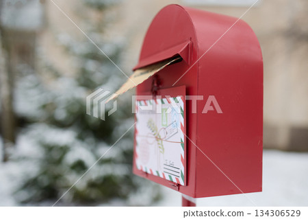 Santa's Mailbox. Red mailbox in snowy landscape holding a letter to Santa. Santa's Mailbox. Red mailbox in snowy landscape holding a letter to Santa. 134306529