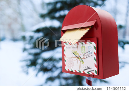 Santa's Mailbox. Red mailbox in snowy landscape holding a letter to Santa. Santa's Mailbox. Red mailbox in snowy landscape holding a letter to Santa. 134306532