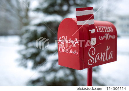 Santa's Mailbox in Snowy Scene. Red mailbox for letters to Santa, set in a snowy winter background Santa's Mailbox in Snowy Scene. Red mailbox for letters to Santa, set in a snowy winter background 134306534