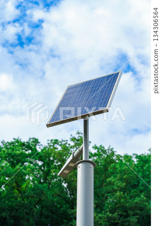 View of a small solar panel installed outdoors against the sky to generate electricity 134306564