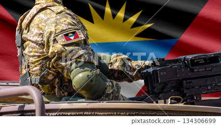 Antigua and Barbuda flag with soldier at machinegun turret 134306699