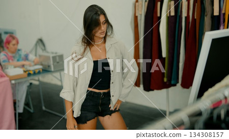 Exciting Fashion Showcase Featuring a Model in a Trendy, EyeCatching Outfit That Captures Attention Exciting Fashion Showcase Featuring a Model in a Trendy, EyeCatching Outfit That Captures Attention 134308157