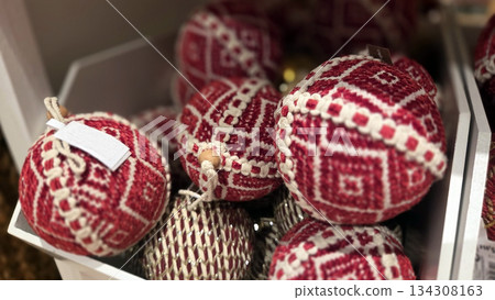 Festive red and white Christmas ornaments in decorative box for holiday season 134308163