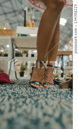 Sophisticated and Elegant High Heels Paired with Fashionable Legs in a Stylish Setting 134308225