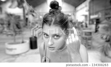 This is a Contemporary Portrait of a Young Woman set within a Vibrant and Lively Space 134308263