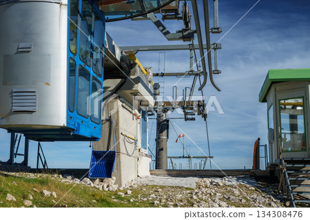 Cable car for suspended chairlifts in the Austrian Alps against the sky in early autumn. 134308476