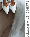 White bridal shoes with pearl straps and wedding veil 134308571
