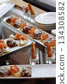 Gourmet appetizers with salmon on serving plates 134308582