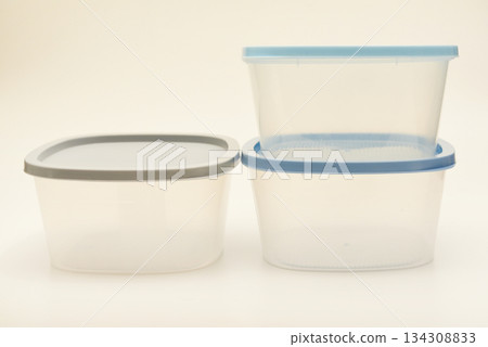 Large containers for food. Three plastic containers with a blue lid for food on a white background. Large containers for food. Three plastic containers with a blue lid for food on a white background. 134308833